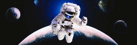 Picture of astronaut spacewalking with glowing stars . Astronaut in outer space.