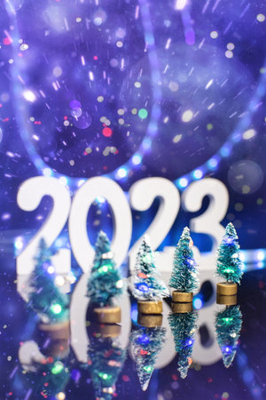 Christmas tree with decoration and lightingt 2023 , Elegant Christmas tree in glass jar with bokeh...