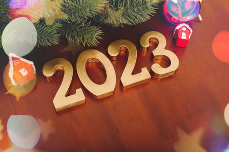 Merry Christmas & Happy New Year Text Design Over Magical Blue Defocused Bokeh Lights and...