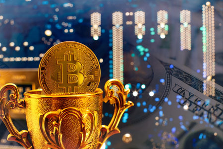 Cryptocurrency concept , Golden bitcoin on winners cup background mainboard , The future of money....