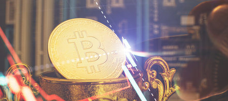 Cryptocurrency concept , Golden bitcoin on winners cup background mainboard , The future of money....