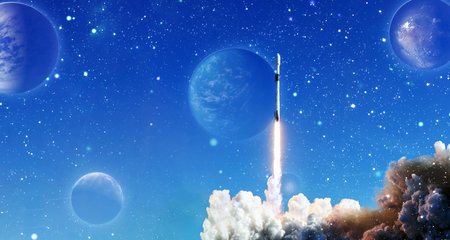 rockets launch into space on the starry sky. spacecraft flies into space with clouds of smoke.の写真素材