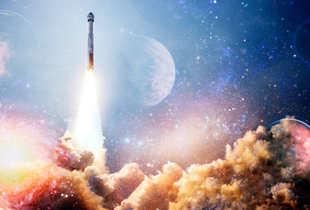 Shuttle launch in the clouds to outer space. Dark space with stars on background.Spaceship flight.の写真素材