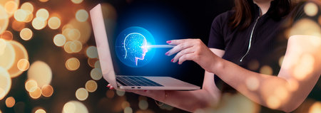 The girl holds a laptop and uses AI for her own purposes