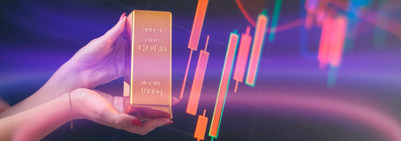 Girl holding gold bar, Business graph background. Buying goldの写真素材