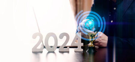 businessman thinking about investments in 2024 at a laptop, investmentの写真素材