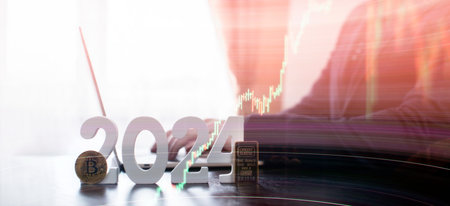 businessman buys gold and bitcoin in 2024 using digital technology and laptop computer.の写真素材