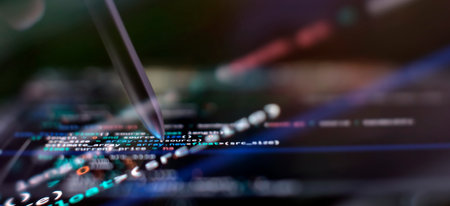 IT business. Monitor closeup of function source code. Project managers