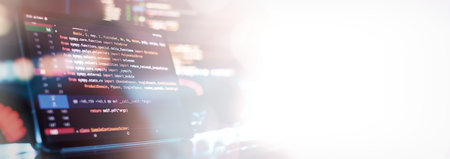Notebook closeup photo. CSS, JavaScript and HTML usage. Monitor closeup of function source code....