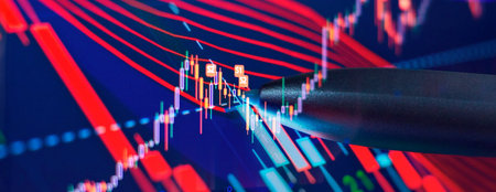 Charts of financial instruments with various type of indicators including volume analysis for professional technical analysis on the monitor of a computer.の写真素材