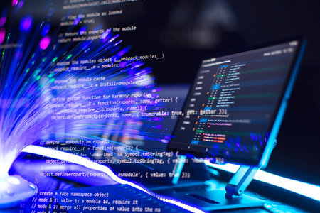 Program code on a computer monitor with fiber optic background. Internet and technology concept.の写真素材