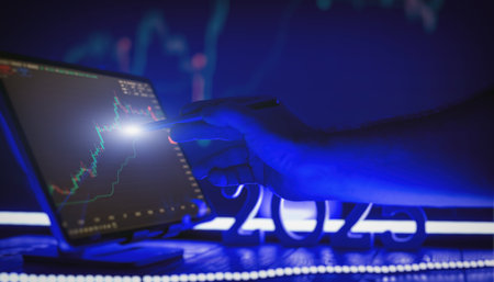 Financial Strategy Visualization Hand with Stylus Pointing to Digital Stock Market Analytics on Futuristicの写真素材
