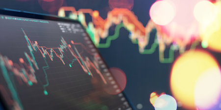 Dynamic Stock Market Analysis with Rising Graph and Blurred Trading Chartの写真素材