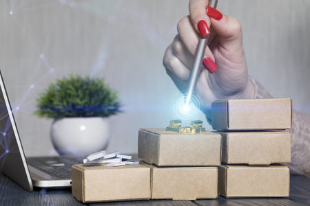 Digital E-Commerce and Precious Metal Investment Workspace with Hand Using Stylus on Stacked...