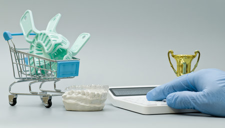 Dental Impression Trays with Calculator and Trophy Conceptの写真素材