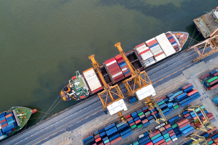 Aerial view of Containers yard in port congestion with ship vessels are loading and discharging operations of the tranport in international port.のeditorial素材