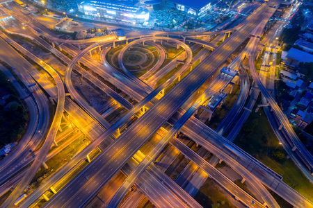 Bangkok Expressway top view, Top view over the highway,expressway and motorway at night, Aerial view interchange of a city, Shot from drone, Expressway is an important infrastructure in Thailandの写真素材