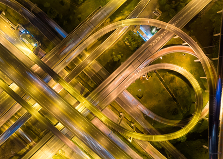 Bangkok Expressway top view, Top view over the highway,expressway and motorway at night, Aerial view interchange of a city, Shot from drone, Expressway is an important infrastructure in Thailandの写真素材