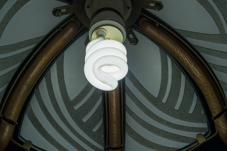 Chandelier with a burning lamp in the dark closeupの写真素材