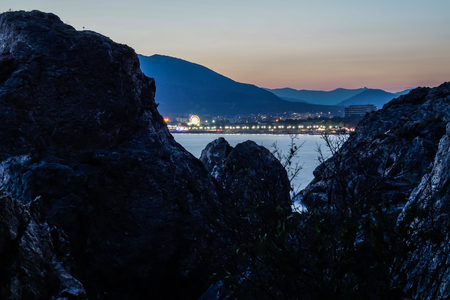 to the beach and the mountain view from the rocksの写真素材