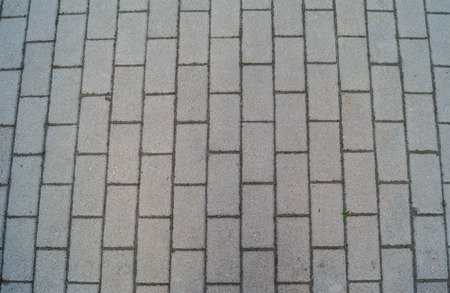 Background of bricks for the pavement of gray