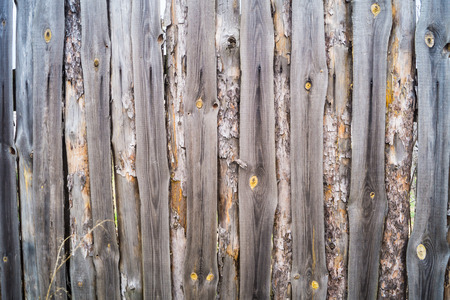 A fence made of old boards closeupの写真素材