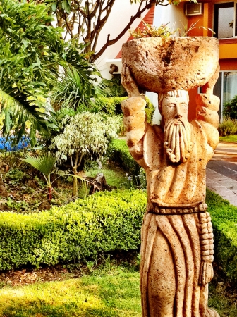 A statue of cleric in the garden of Mxicoの素材