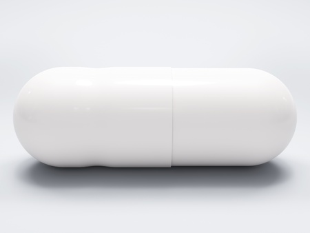 White medical pill on white background, with shadow, closeupの写真素材