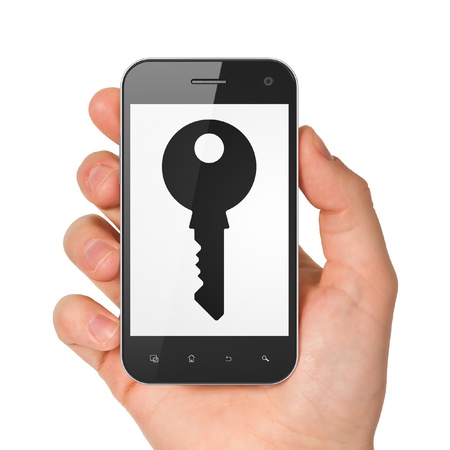 Privacy concept  hand holding smartphone with Key on display  Generic mobile smart phone in hand on White background の写真素材
