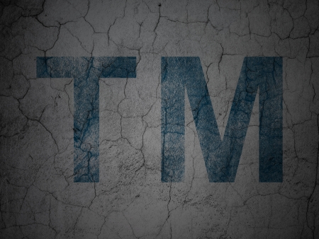 Law concept: Blue Trademark on grunge textured concrete wall background, 3d renderの写真素材