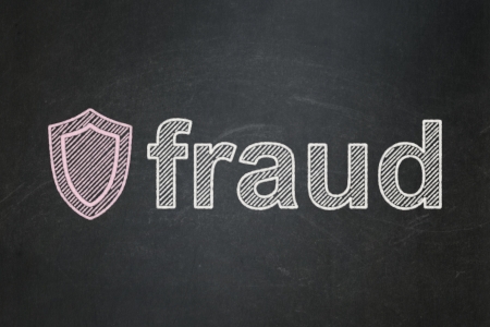 Protection concept: Shield icon and text Fraud on Black chalkboard background, 3d renderの写真素材