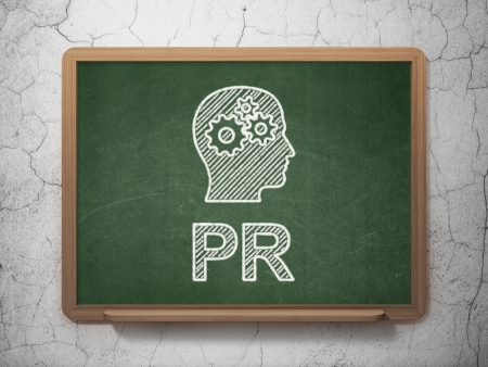 Marketing concept: Head With Gears icon and text PR on Green chalkboard on grunge wall background, 3d renderの写真素材