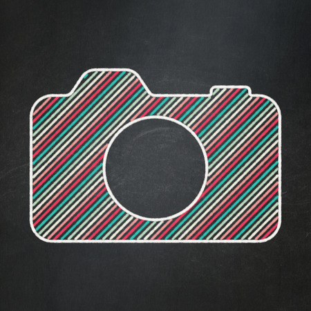 Travel concept: Photo Camera icon on Black chalkboard background, 3d renderの写真素材