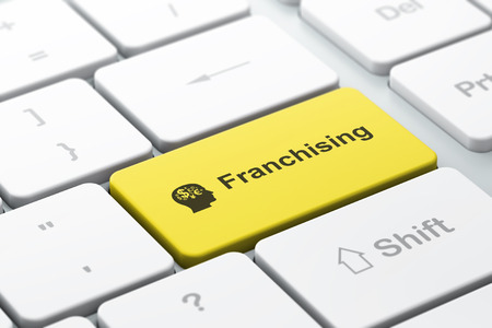 Business finance concept: computer keyboard with Head With Finance Symbol icon and word Franchising, selected focus on enter button, 3d renderの写真素材