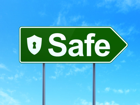 Safety concept: Safe and Shield With Keyhole icon on green road (highway) sign, clear blue sky background, 3d renderの写真素材