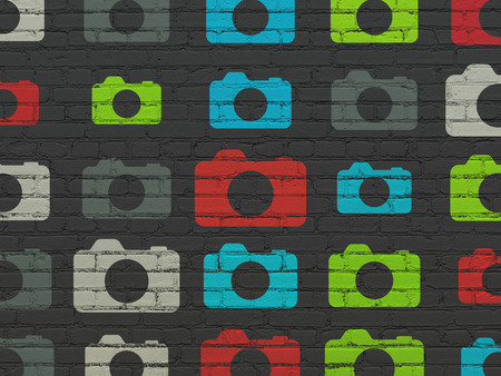 Travel concept: Painted multicolor Photo Camera icons on Black Brick wall background, 3d renderの写真素材