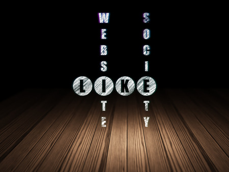 Social media concept: Glowing word Like in solving Crossword Puzzle in grunge dark room with Wooden Floor, black background, 3d renderの写真素材