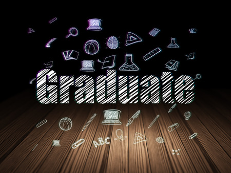 Learning concept: Glowing text Graduate,  Hand Drawn Education Icons in grunge dark room with Wooden Floor, black background, 3d renderの写真素材