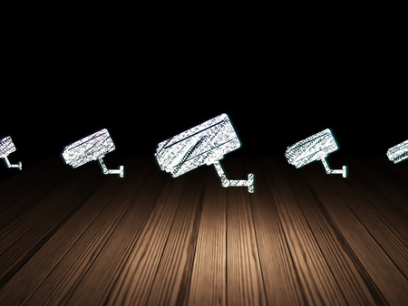 Protection concept: row of Glowing cctv camera icons around cctv camera icon in grunge dark room...