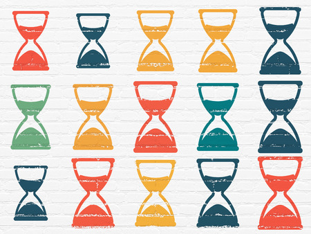Time concept: Painted multicolor Hourglass icons on White Brick wall backgroundの写真素材