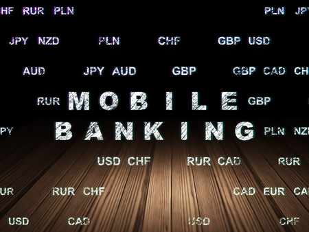 Money concept: Glowing text Mobile Banking in grunge dark room with Wooden Floor, black background with Currencyの写真素材