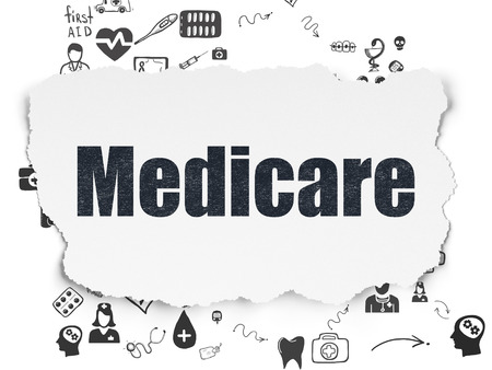 Health concept: Painted black text Medicare on Torn Paper background with Scheme Of Hand Drawn Medicine Iconsの写真素材
