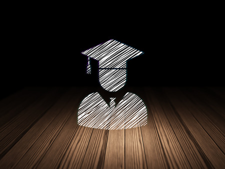 Science concept: Glowing Student icon in grunge dark room with Wooden Floor, black backgroundの写真素材