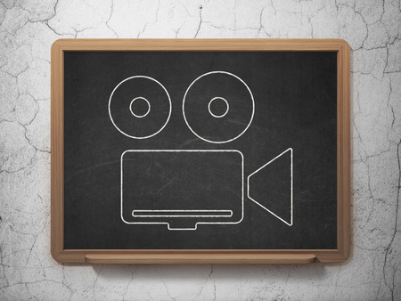 Travel concept: Camera icon on Black chalkboard on grunge wall backgroundの写真素材