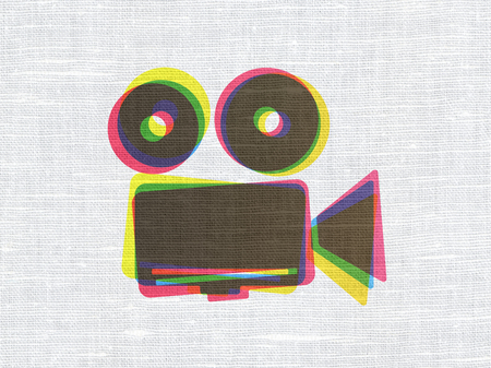 Travel concept: CMYK Camera on linen fabric texture background