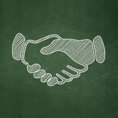 Politics concept: Handshake icon on Green chalkboard backgroundの写真素材