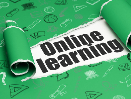 Studying concept: black text Online Learning under the curled piece of Green torn paper with  Hand Drawn Education Iconsの写真素材
