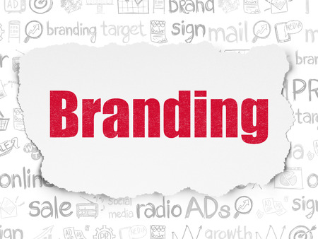 Marketing concept: Painted red text Branding on Torn Paper background with  Hand Drawn Marketing Iconsの写真素材