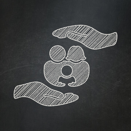 Insurance concept: Family And Palm icon on Black chalkboard backgroundの写真素材