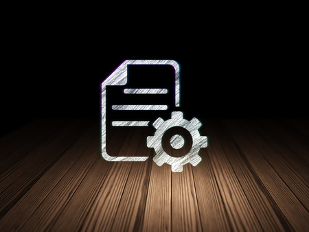 Software concept: Glowing Gear icon in grunge dark room with Wooden Floor, black backgroundの写真素材